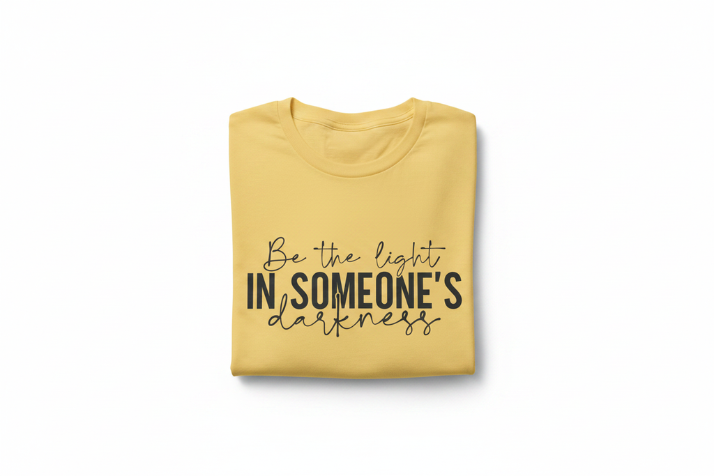 Be the Light Tee — Folded on White Background