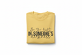 Be the Light Tee — Folded on White Background