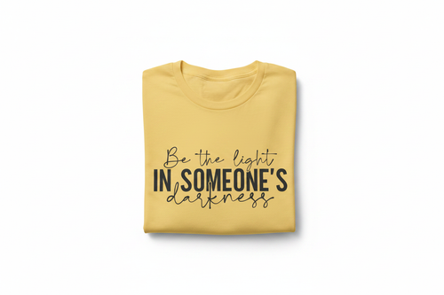 Be the Light Tee — Folded on White Background